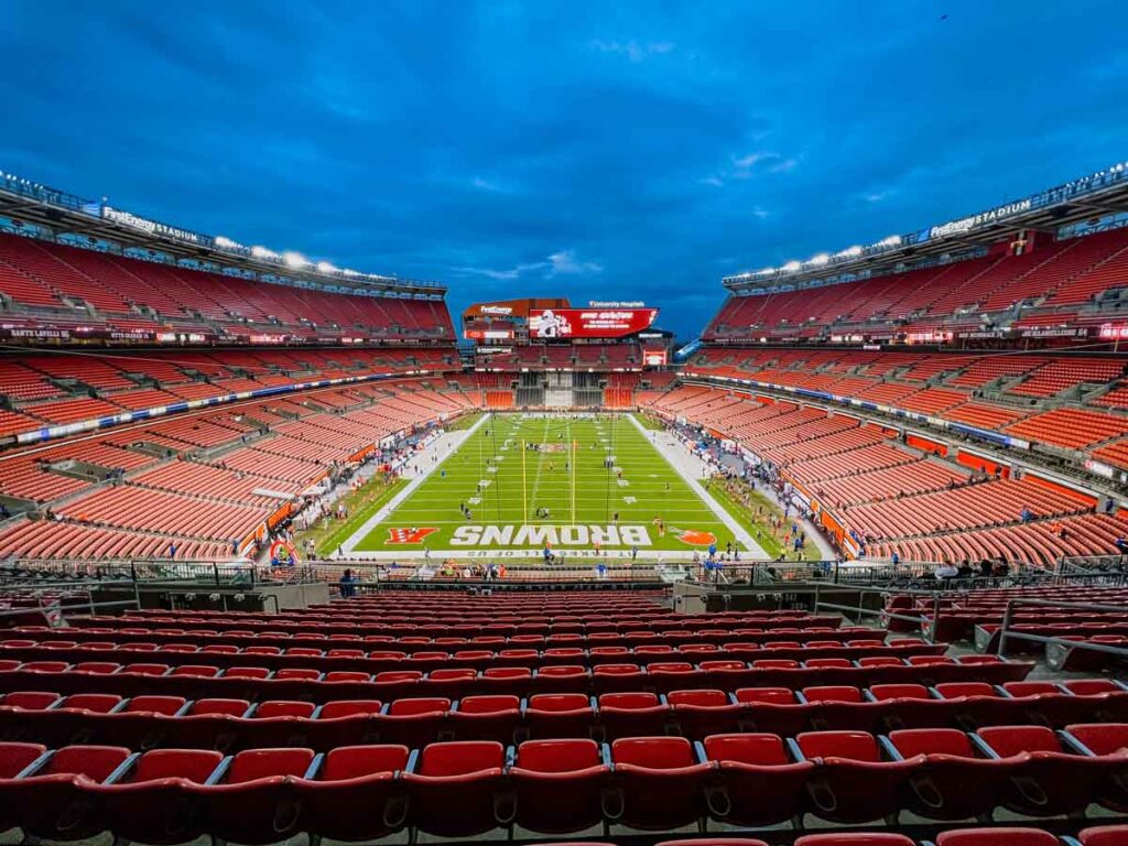 a nighttime view of the Cleveland Browns Stadium from the upper levels endzone.