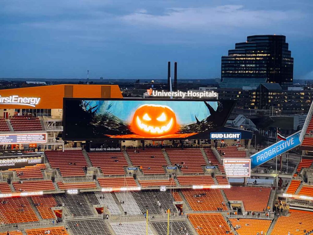 a carved pumpkin on the scoreboard at Cleveland Browns Stadium on Monday Night Football - Halloween Edition.