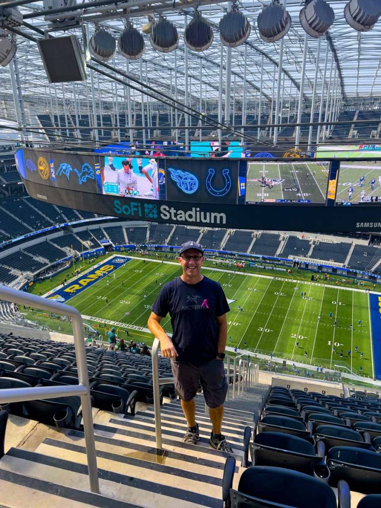 Dan Brewer, owner of the Ultimate Sports Road Trip travel blog, checks out the mid-field 500 level seats at SoFi Stadium prior to a Rams home game.