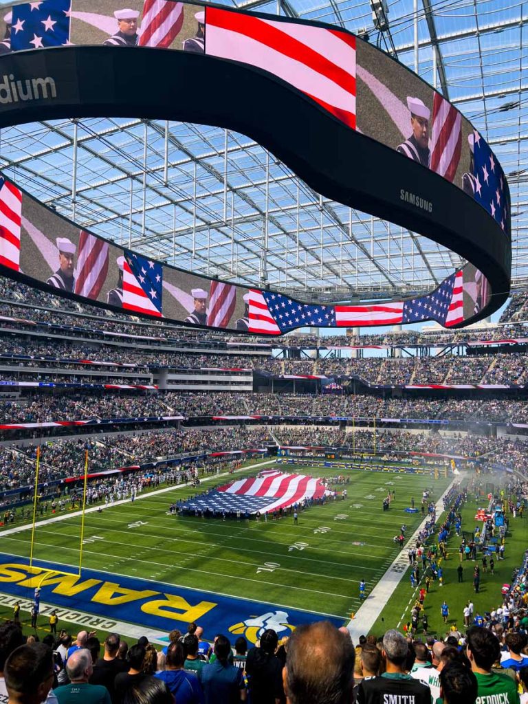 The American flag on the field and on the video scoreboard during the national anthem at an LA Rams home game.