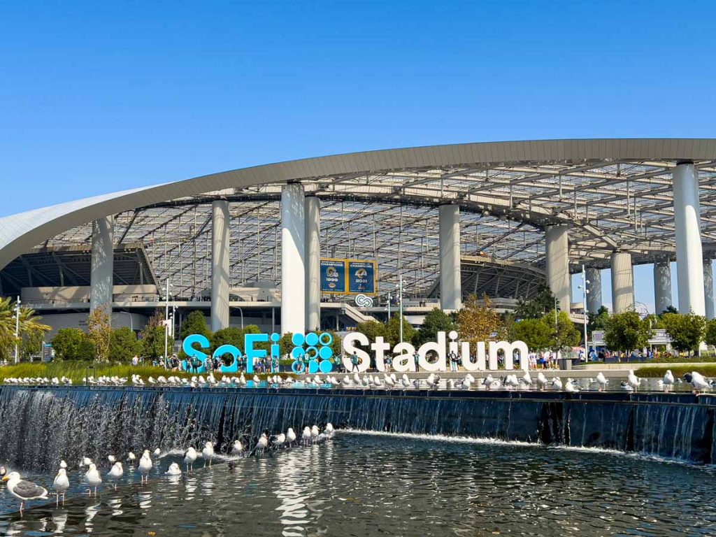seagulls hang out by the lake in front of SoFi Stadium, home of the Los Angeles Rams.