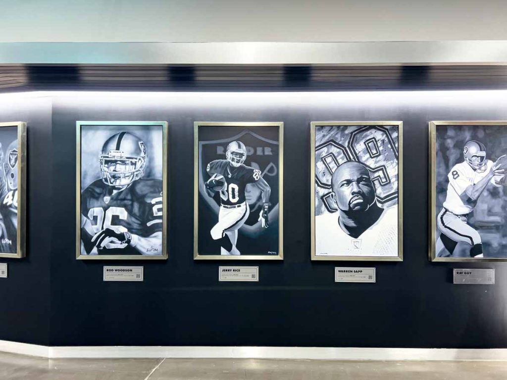 Paintings of legendary Oakland Raiders players hang in a gallery inside Allegiant Stadium in Las Vegas, Nevada.