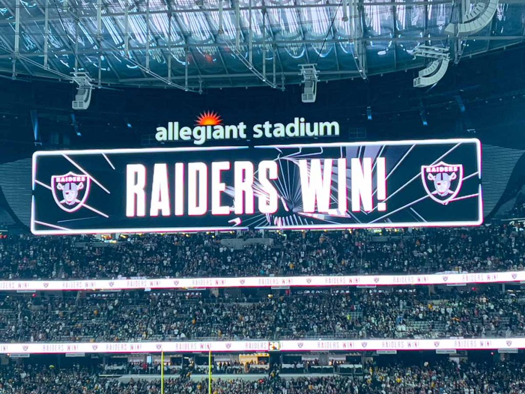 The scoreboard at Allegiant Stadium reads, "Raiders Win" after a victory over the Green Bay Packers on MNF.