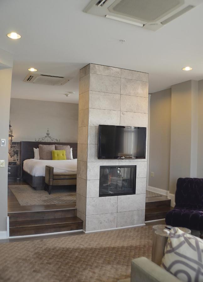 A luxurious room with a fireplace at the Hotel at the Lafayette Trademark Collection.