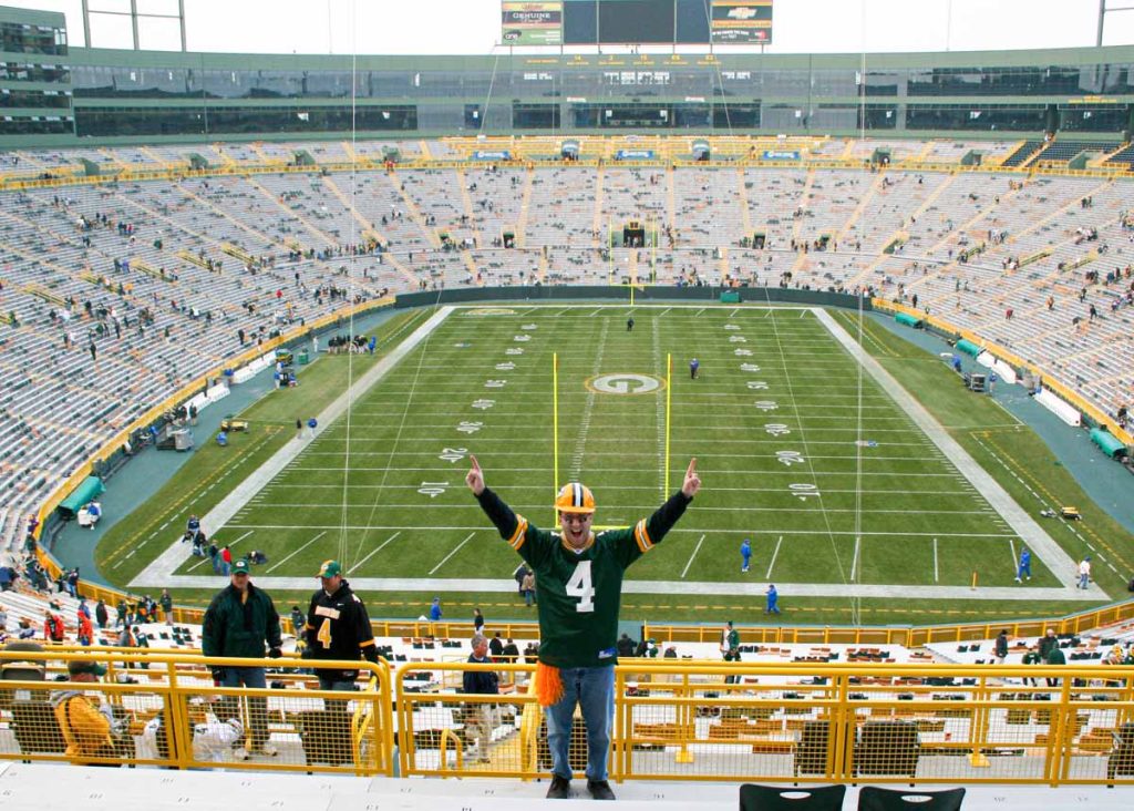 Dan Brewer, owner of UltimateSportsRoadTrip.com, wears a Brett Favre jersey after a Green Bay Packers game at Lambeau Field.