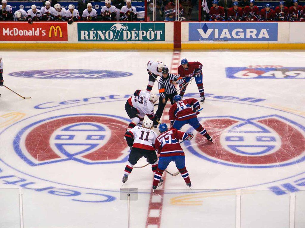 The Montreal Canadiens and the Ottawa Senators face off to begin an NHL game at the Bell Centre in Montreal, QC.