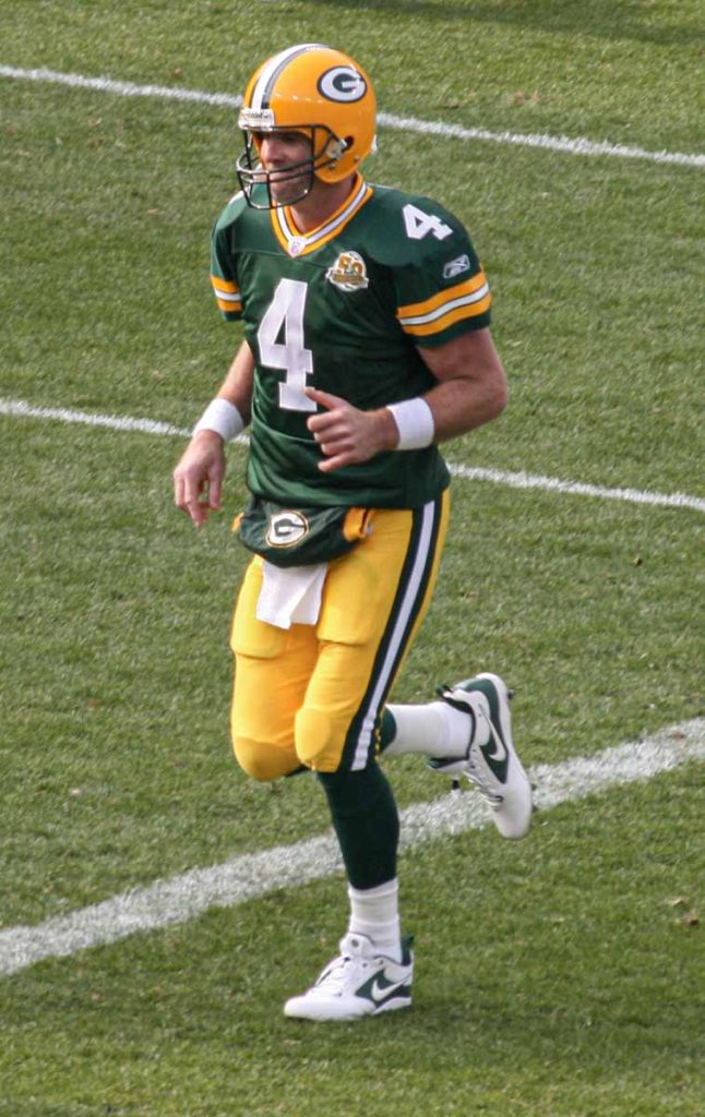 Brett Favre of the Green Bay Packers wears home jersey #4.