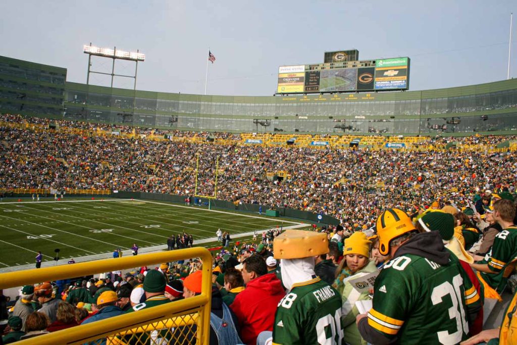 NFL fans watch the Packers play the Vikings in an NFC North match at Lambeau Field.