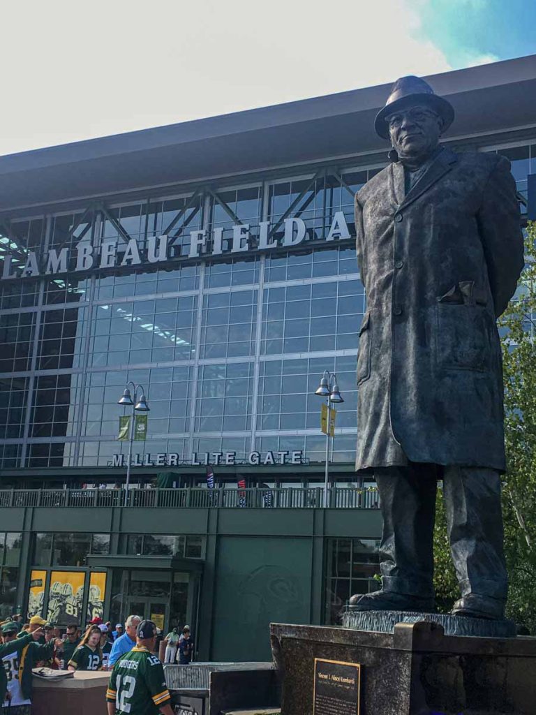 A statue of legendary coach Vince Lombardi stands in front of Lambeau Field in Green Bay, WI.