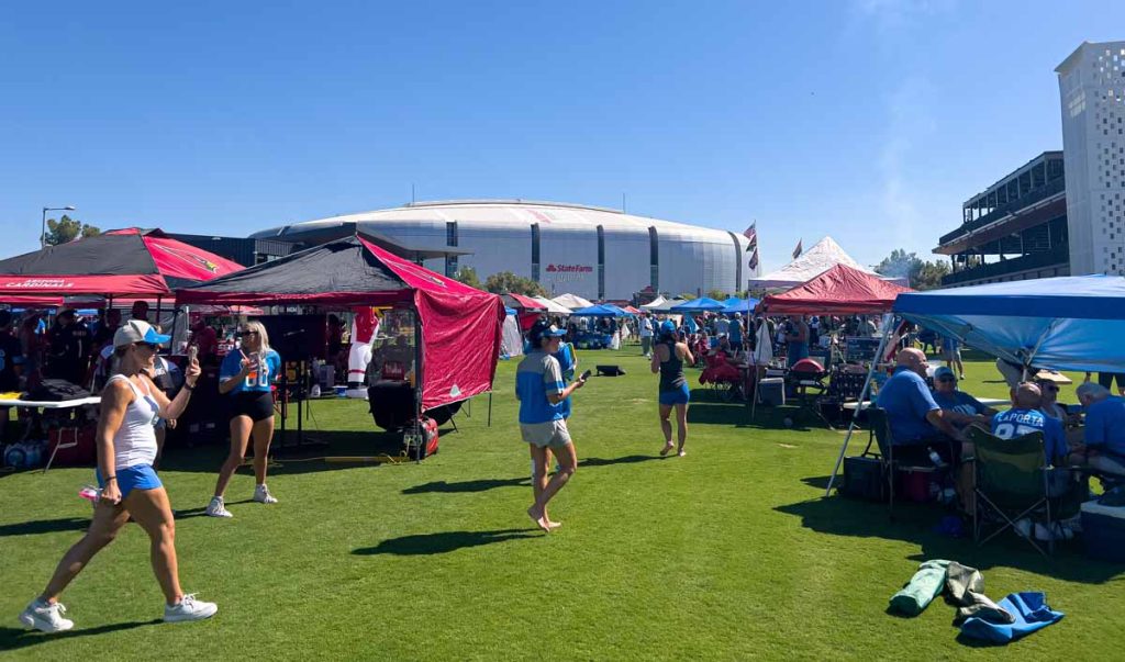 Lions and Cardinals fans enjoy some pregame partying on the Great Lawn just outside State Farm Stadium.