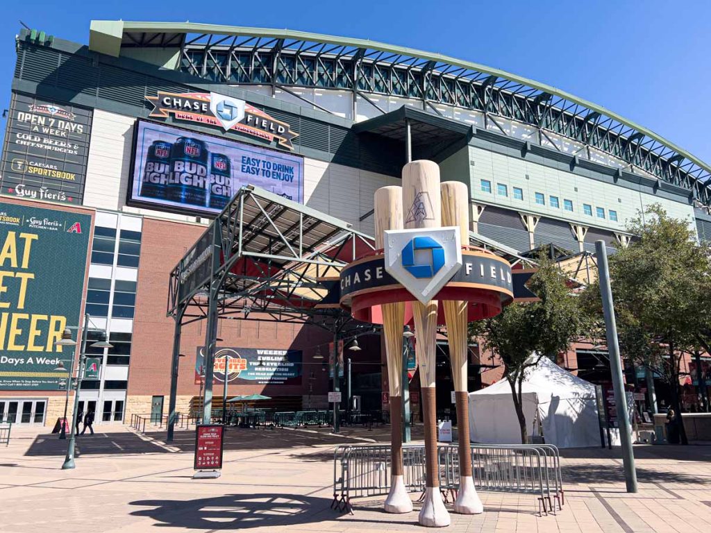 The Case Field sign outside the stadium is held up by three large baseball bats.