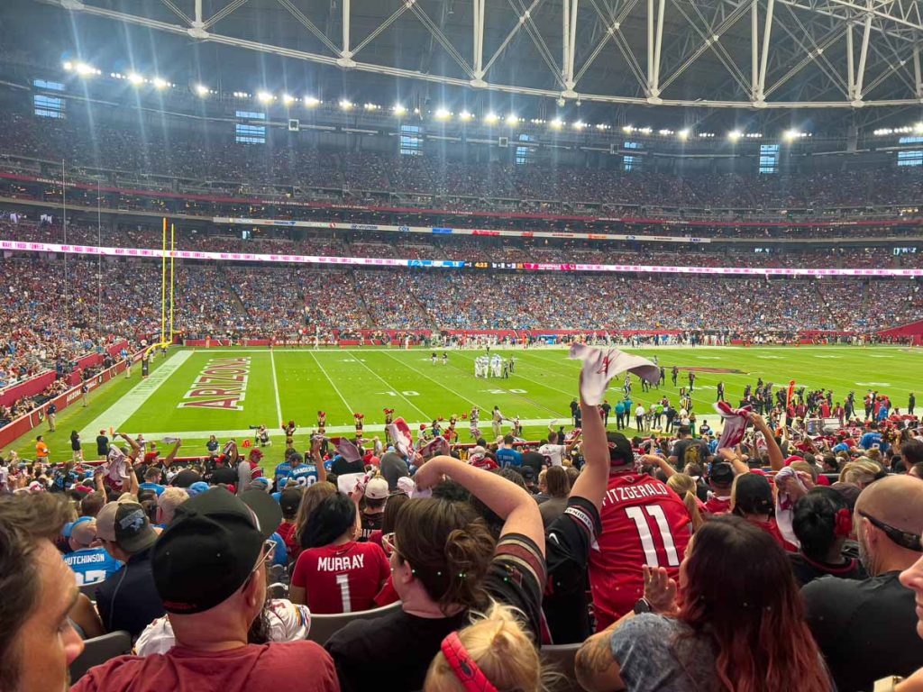 Football fans enjoy an Arizona Cardinals game at State Farm Stadium.