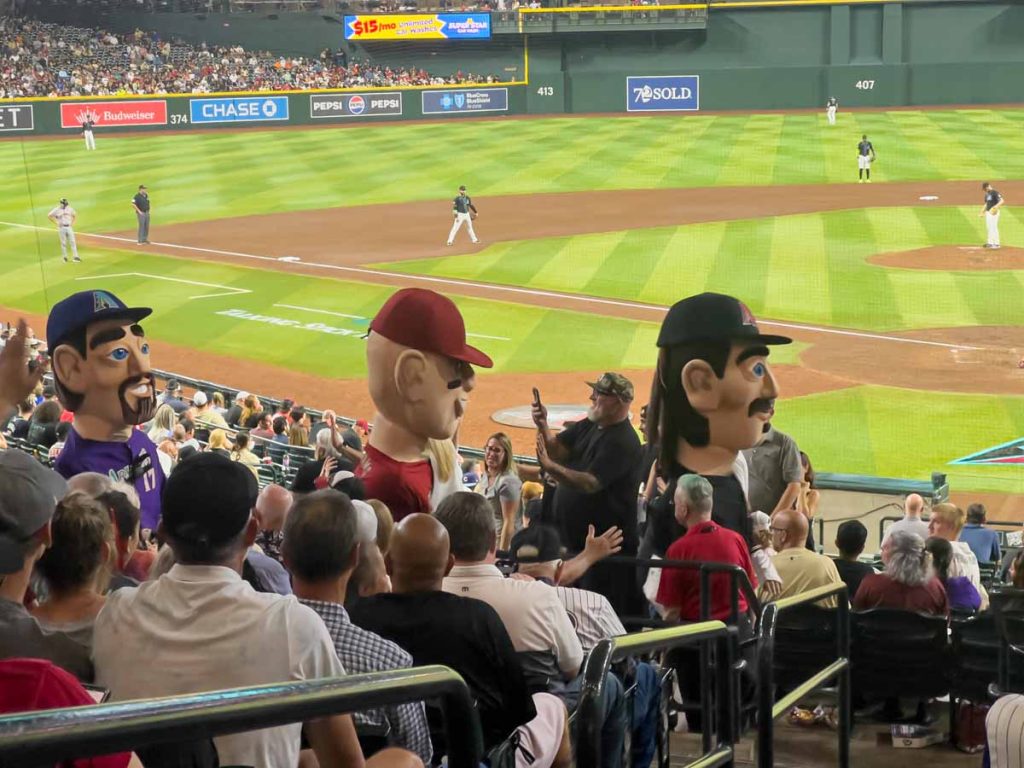 Mascot versions of legendary D-backs players roam through the seats at Chase Field.