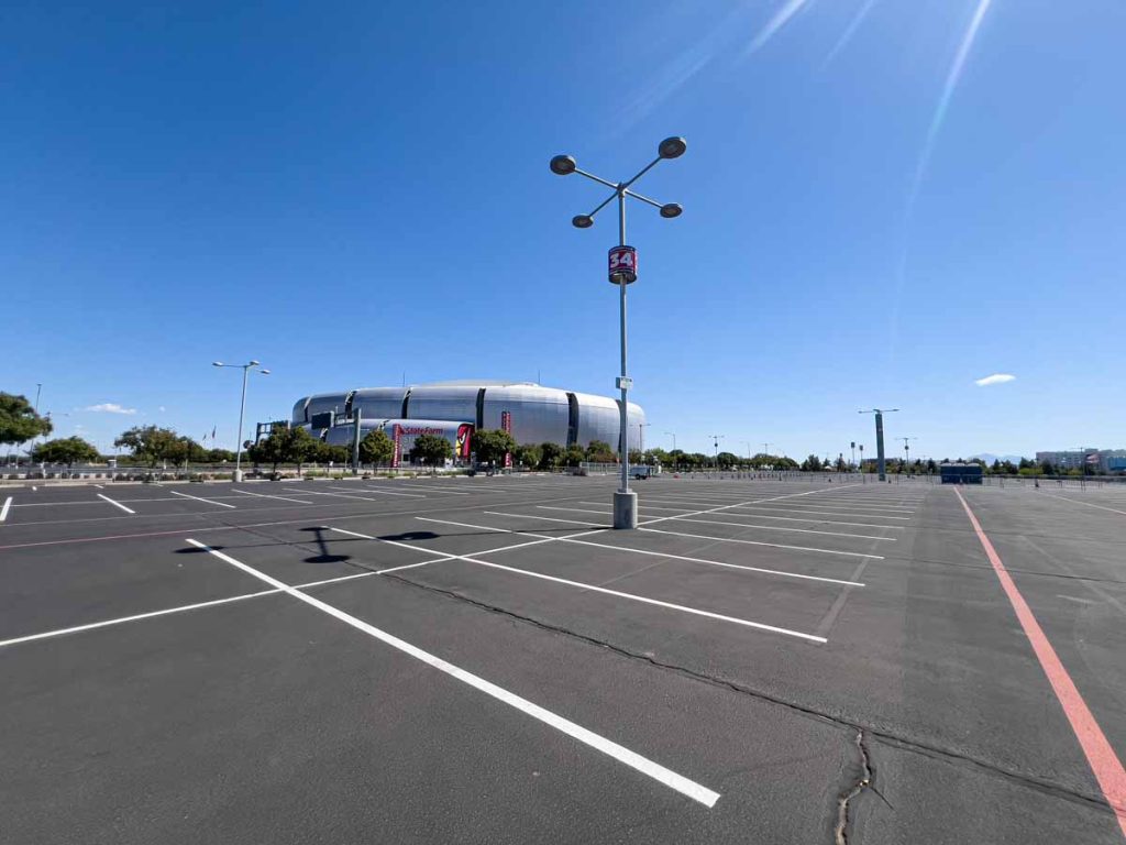 A massive empty parking lot outside State Farm Stadium - home of the Arizona Cardinals.