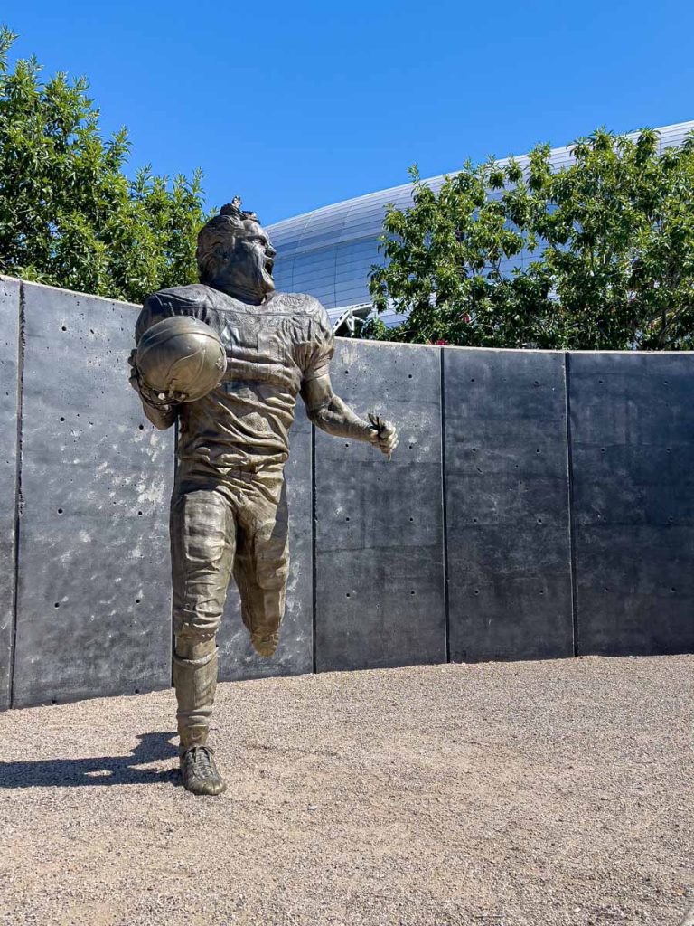 A bronze statue of Pat Tillman outside State Farm Stadium.