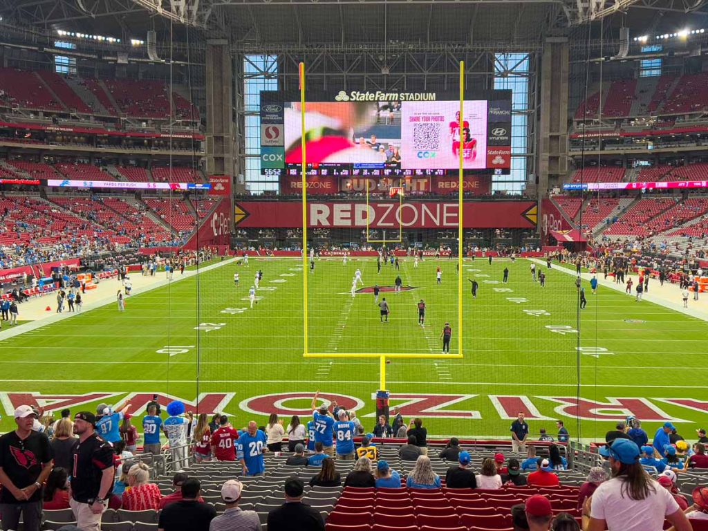 The view from the end zone at State Farm Stadium during the pregame warmup at an Arizona Cardinals game.