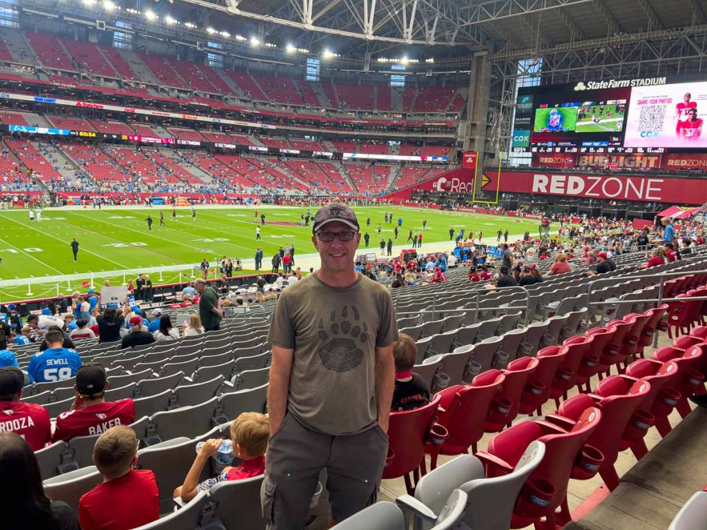 Dan Brewer, owner of UltimateSportsRoadTrip.com, checks out his seat for his first Arizona Cardinals home game in Section 113 of State Farm Stadium.